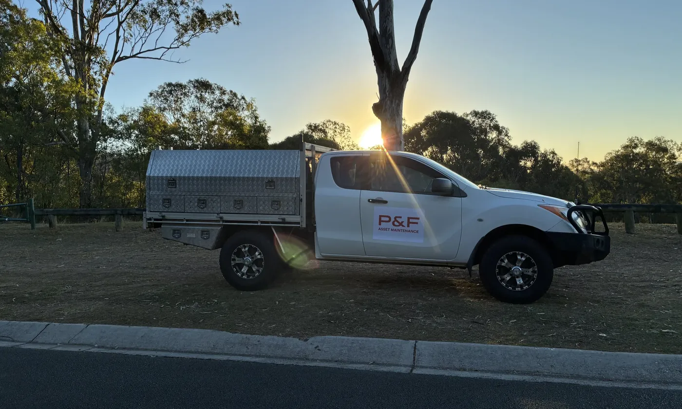 Plant & Fixed branded service ute parked on a rural property at sunrise
